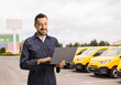 © Ljupco Smokovski - Auto mechanic with a laptop computer on a parking lot