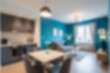 © Nyetock - Modern Blue Living Room and Dining Area Interior with Contemporary Furniture. Blurred background.