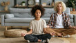 © Julia - Child practicing breathing with parent in a peaceful living room after feeling upset emotional regulation moment