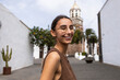 © ADDICTIVE STOCK - Smiling woman in Lanzarote with historic background