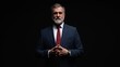 © opolja - Studio portrait of senior businessman in suit on dark background