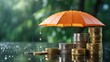 © MSTMAYA - Stacks of gold and silver coins protected under a bright orange umbrella during a rainstorm, symbolizing financial security and wealth preservation