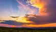 © DAVA - Vibrant sunset over mountainous landscape horizon.