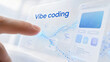 © Elena - Developer finger tapping on virtual interface with vibe coding text. Digital screen displaying software development concept. Innovative technology for modern cloud computing and design.