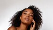 © Air H - Confident young Black woman with natural freckles and voluminous curly hair in minimalist beauty portrait, glowing healthy skin, natural makeup, skincare, diversity and self confidence concept