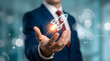 © Muhammad - A businessman in a blue suit and red tie holds a glowing rocket icon in his palm, symbolizing innovation and growth against a blurred, modern office background with bokeh lights, technology, success