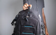 © andranik123 - Man showing professional photography backpack.
