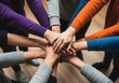 © Artifact Store - Diverse group stacking hands together. Team building concept showing unity and cooperation.