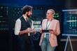© Zamrznuti tonovi - It specialists discussing server room maintenance, managing a data center and analyzing network infrastructure performance