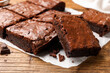 © New Africa - Yummy chocolate brownies on wooden table, closeup