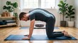© Azorahaiá - Man performing yoga cat cow pose with glowing spine visualization for spinal health awareness