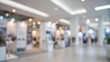 © Moeza - Blurred view of a modern exhibition hall with trade show stands.
