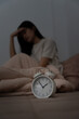 © Shisu_ka - asian woman in bed late trying to sleep suffering insomnia, sleepless or scared in a nightmare, looking sad worried and stressed. Tired and headache or migraine waking up in the middle of the night.