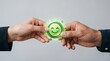 © Arafat - Two people holding a digital customer satisfaction smiley icon