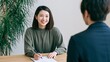 © AI-HAL8 - 相談窓口で穏やかに微笑み筆記する日本人女性の風景