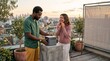 © Николай Срибяник - Diverse young couple setting up a movie projector on a city rooftop at sunset.