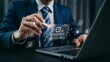 © Rajmina - Businessman using laptop with AI agents interface and digital technology icons