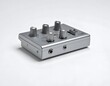 © Erni - Studio shot of a metallic silver guitar effects pedal with knobs and ports