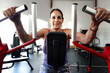 © Luis Herrera/Stocksy - Mature Woman Training on Weight Machine at Gym