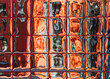 © Natalia Mishina/Stocksy - Reflection on a glass surface in a city setting during the day