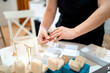 © Alfonso Soler - Woman arranging handmade jewelry, preparing for sale and showcasing her craft