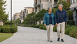 © Korsak78de - Active senior couple walking in modern residential neighborhood