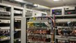 © Justlight - Central office switching room blending old and new tech detailed focus on integrated fiber and copper patch panels with soft bokeh effects on peripheral equipment.