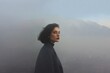 © Katya - Moody outdoor portrait of a woman in misty mountains left profile for editorial portrait background and banner design