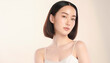 © Nando - Young Asian woman with glowing skin and short hair in studio portrait