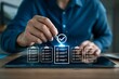 © resky - Manager pointing pen at glowing digital checklist icons for task completion and organizational planning