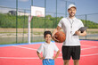 © Ljupco Smokovski - Kid and a basketball coach
