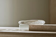 © Milos - A beautifully crafted glass sculpture resting on a textured surface, casting gentle shadows and showcasing the interplay of light and form, creating an inviting artistic piece.