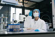 © NINENII - Lab work, scientists holds a test tube takes the test from a test tube in analysis for vaccine development.