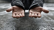 © Mrammon - Poverty homeless begging hands help support compassion hope donation street Human hands held open plea wet street showing poverty homeless begging hands help support compassion and hope