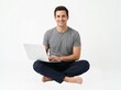 © GradPlanet - Happy man sitting with a laptop computer