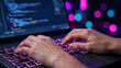 © ArtFocus Studio - Close-up of a programmer's hands typing on a backlit laptop keyboard with source code on screen and colorful bokeh background