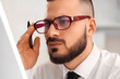 © Pixel-Shot - Male trader in eyeglasses working at office, closeup