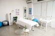 © Pixel-Shot - Interior of massage therapists office with workplace, couch and professional equipment in modern medical centre