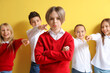 © Pixel-Shot - Bullied little boy and his classmates on yellow background