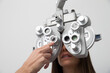 © Westend61 - Woman at the optometrist making an eye test