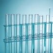 © jihyun - a rack of clear laboratory test tubes — tight close crop showing texture and material