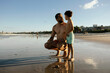 © kleberpicui - Father And Son Talking On Sunset Beach At Low Tide - Family Bonding And Summer Vacation
