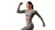 © Tuhin - Fit young woman exercising in sportswear. Female athlete working out in gym setting.