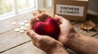 © Trisnawati - Hands holding red heart for charity concept.