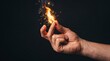 © luiz.iz - Male Hand Snapping Fingers Creating Flame Sparkles and Smoke on Dark Background