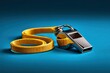 © Gwendolyn Davis - Chrome referee whistle with yellow lanyard on blue background in a sharp focus macro shot for sports coaching and athletic training marketing