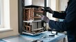 © 123sasha - Technician repairs cooling unit in workshop during daytime