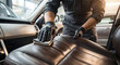 © Olena Smerichka - Close up of hand cleaning leather car seat with cloth, automotive detailing and hygiene concept.