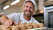 © The Little Hut - Smiling Baker Proudly Presents Freshly Baked Scones in a Commercial Kitchen Environment