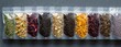 © Vadym - Assorted pouches display various dry tea leaves herbs and flower petals. Collection offers diverse flavors like chamomile hibiscus lavender green and black tea types.